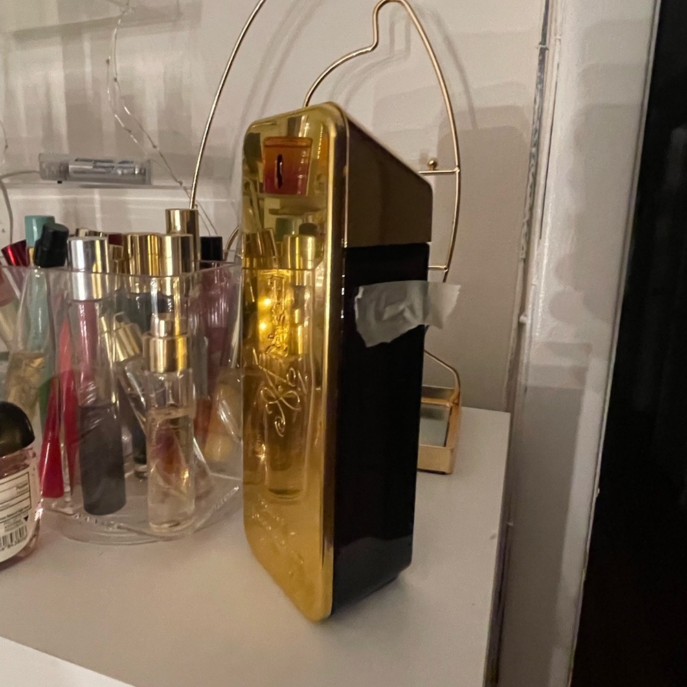 Used Paco Rabanne 1 million 6.8 oz. The top of tape shows how much used